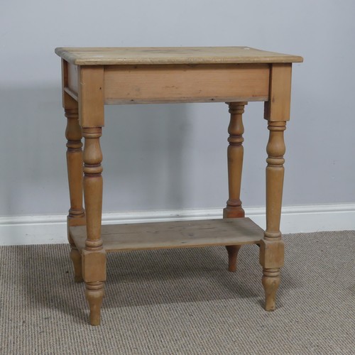 563 - An antique pine side Table, the rectangular top raised on turned supports and under tier, W 63 cm x ... 