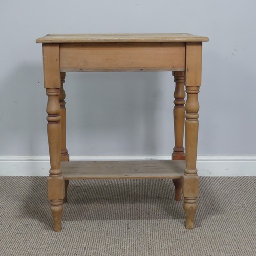 563 - An antique pine side Table, the rectangular top raised on turned supports and under tier, W 63 cm x ... 