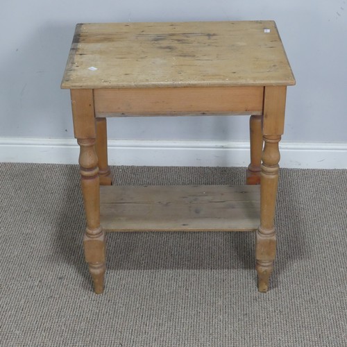 563 - An antique pine side Table, the rectangular top raised on turned supports and under tier, W 63 cm x ... 