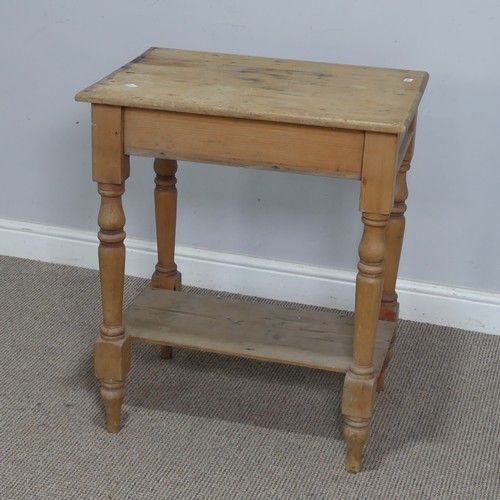 563 - An antique pine side Table, the rectangular top raised on turned supports and under tier, W 63 cm x ... 