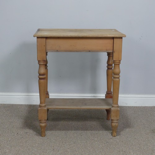 563 - An antique pine side Table, the rectangular top raised on turned supports and under tier, W 63 cm x ... 