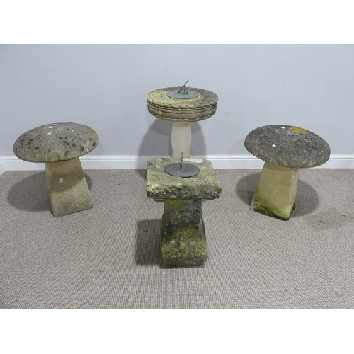 694 - Garden statuary, reconstituted stone: two  sundials, together with a pair of staddle stones (4)... 