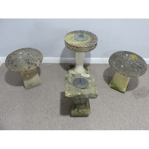 694 - Garden statuary, reconstituted stone: two  sundials, together with a pair of staddle stones (4)... 