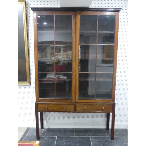 700 - An Edwardian mahogany astragal glazed Bookcase on stand, with dentil cornice and two frieze drawers,... 