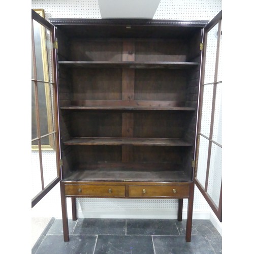 700 - An Edwardian mahogany astragal glazed Bookcase on stand, with dentil cornice and two frieze drawers,... 