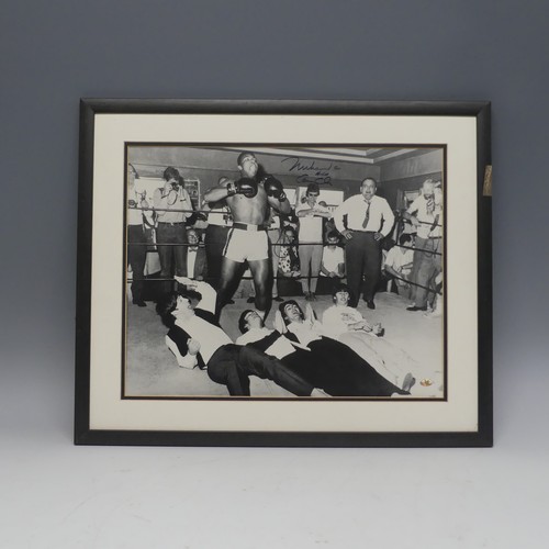 277 - Sporting Interest; a black and white photograph of Muhammad Ali and The Beatles, signed in marker pe... 