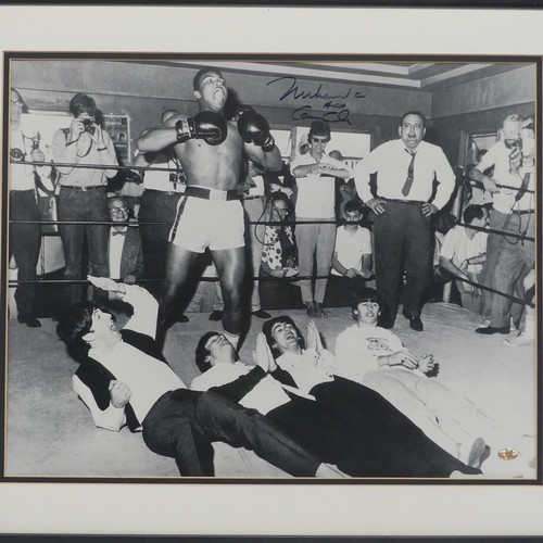 277 - Sporting Interest; a black and white photograph of Muhammad Ali and The Beatles, signed in marker pe... 