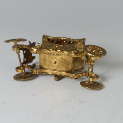 514 - An early 20th Century novelty tape Measure, in the form of a gilt metal Coronation Coach/Carriage, w... 