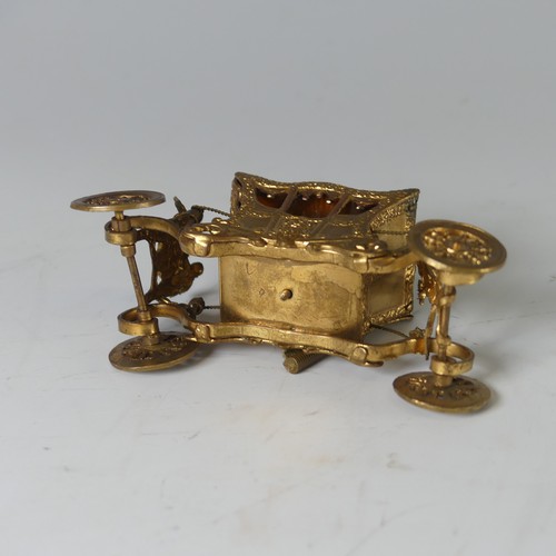 514 - An early 20th Century novelty tape Measure, in the form of a gilt metal Coronation Coach/Carriage, w... 