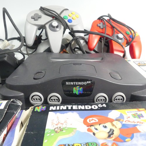 321 - A Nintendo 64 gaming Console, together with two Nintendo 64 controllers, and five Nintendo 64 boxed ... 