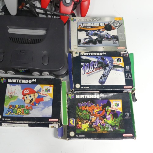 321 - A Nintendo 64 gaming Console, together with two Nintendo 64 controllers, and five Nintendo 64 boxed ... 