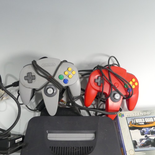 321 - A Nintendo 64 gaming Console, together with two Nintendo 64 controllers, and five Nintendo 64 boxed ... 