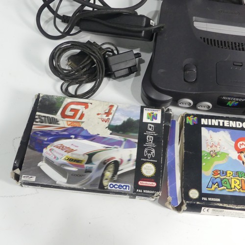 321 - A Nintendo 64 gaming Console, together with two Nintendo 64 controllers, and five Nintendo 64 boxed ... 