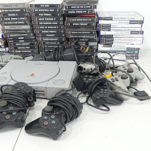 240 - A Large selection of Sony PlayStation, including; PlayStation One, seven controllers, Falcon pistol ... 