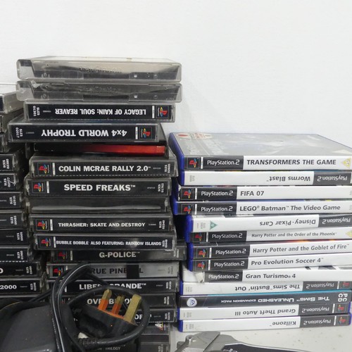 240 - A Large selection of Sony PlayStation, including; PlayStation One, seven controllers, Falcon pistol ... 