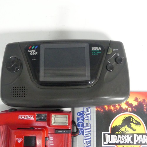 243 - A SEGA Game Gear Portable games Console, together with three SEGA Game Gear games including; Chuck R... 