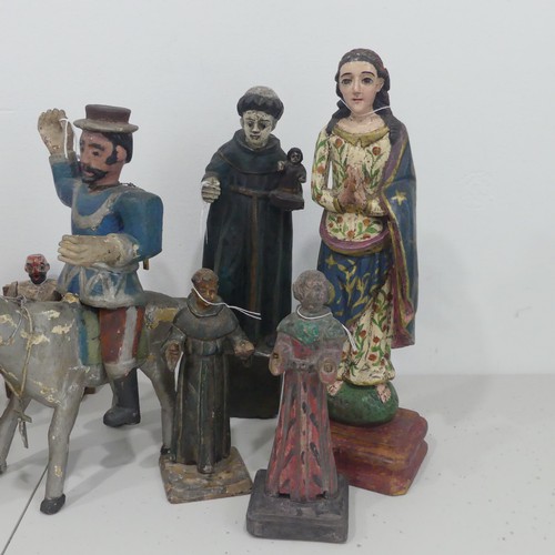 235 - A collection of 19th century and later Guatemalan style Religious folk Statues, including; Saint Jam... 