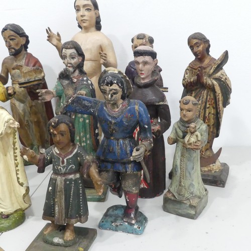 238 - A large collection of 19th and 20th century carved Guatemalan style Religious Statues, including; Ch... 