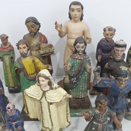 238 - A large collection of 19th and 20th century carved Guatemalan style Religious Statues, including; Ch... 