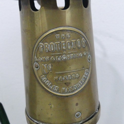 217 - A vintage brass Safety Lamp, by The Protector Lamp and Lighting Company, Eccles, together with a sma... 