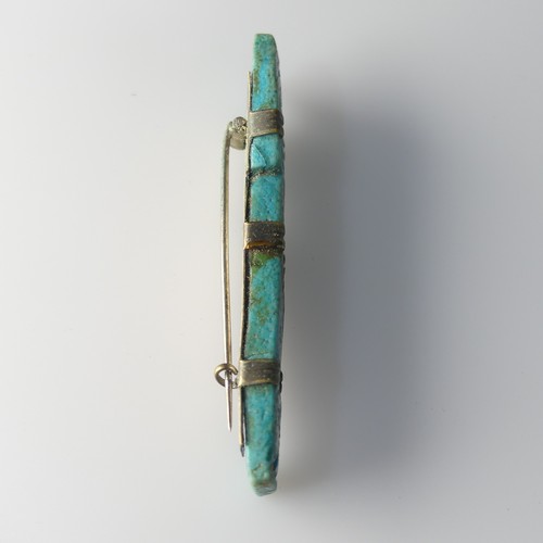 500 - An Egyptian blue faience 'Son of Horus' Amulet, later modified into a brooch, cracked, H 7 cm, Prove... 