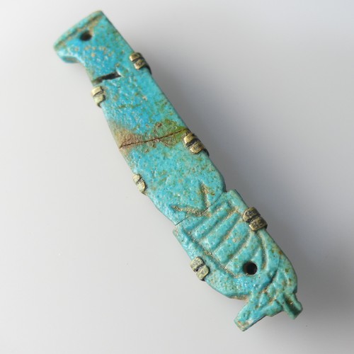 500 - An Egyptian blue faience 'Son of Horus' Amulet, later modified into a brooch, cracked, H 7 cm, Prove... 