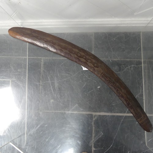 701 - An early 20thC Australian Aboriginal Fighting Club Boomerang, one side with carved geometric and sta... 