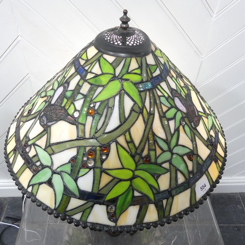 554 - An Art Deco Tiffany & Co style stained glass Lamp, the glass shade and body with stylised bamboo... 