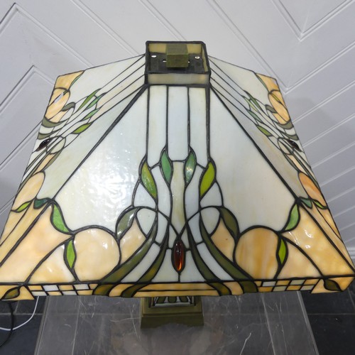 552 - An Art Deco Tiffany & Co style stained glass Lamp, the glass shade and body with stylised floral... 