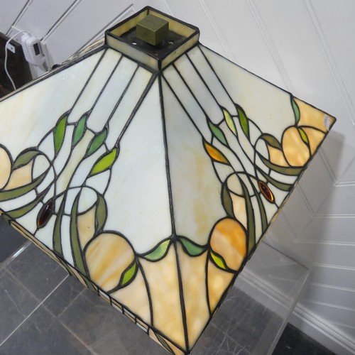 552 - An Art Deco Tiffany & Co style stained glass Lamp, the glass shade and body with stylised floral... 