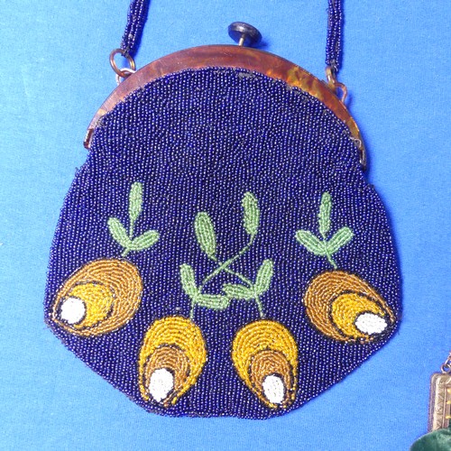 706 - An early 20th century beaded Evening purse, together with an Art Deco black silk evening purse with ... 