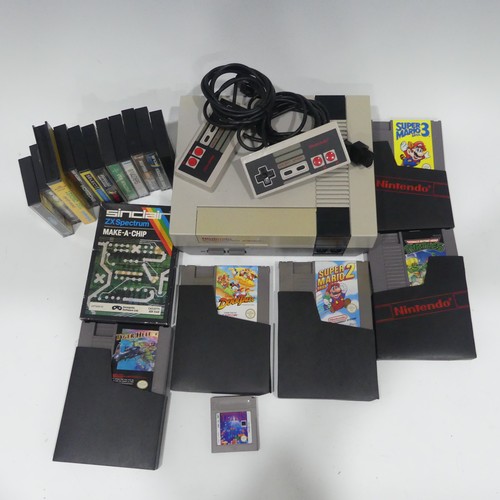 242 - A vintage Nintendo entertainment System NES version, together with two Nintendo Nes-004E Controllers... 