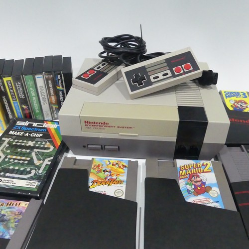 242 - A vintage Nintendo entertainment System NES version, together with two Nintendo Nes-004E Controllers... 