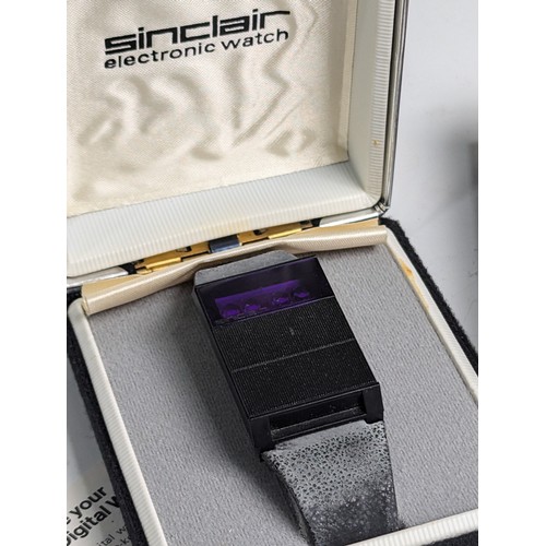 260 - A Sinclair 'The Black Watch' electronic Digital Watch, boxed with outer card slip case, strap discol... 