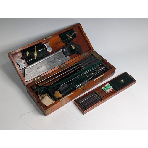 205 - A late 19th/early 20th century Arnold & Sons flame mahogany brass bound cased Field Surgeon's Ki... 