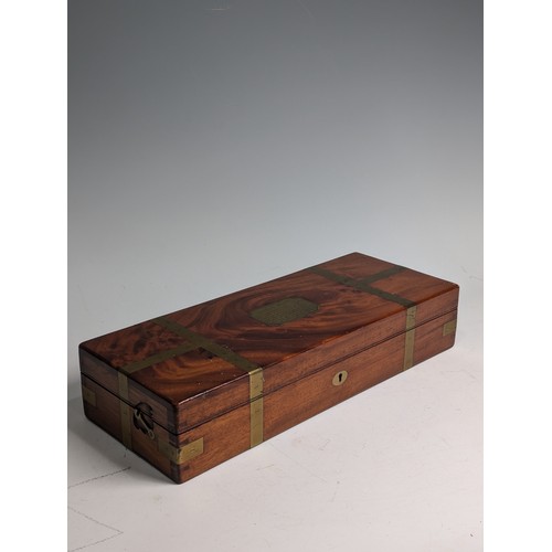 205 - A late 19th/early 20th century Arnold & Sons flame mahogany brass bound cased Field Surgeon's Ki... 