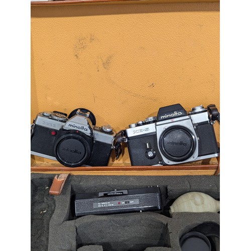 219 - A Minolta XE-5 35mm camera body and a Minolta XG-1 35mm camera body, together with two lenses, Minol... 