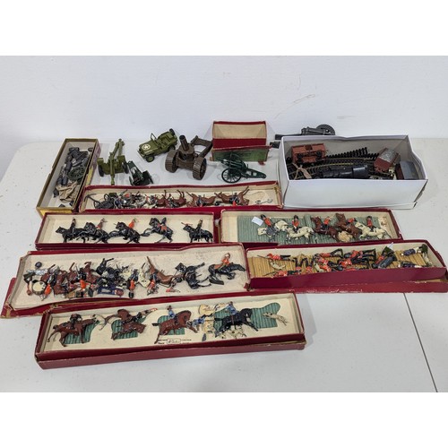 325 - Britains No.1201 Royal Artillery Gun, boxed, and two Britains 18″ Heavy Howitzers with shells, both ... 