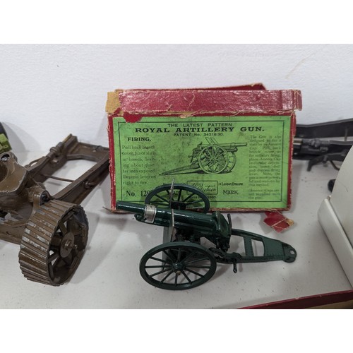 325 - Britains No.1201 Royal Artillery Gun, boxed, and two Britains 18″ Heavy Howitzers with shells, both ... 