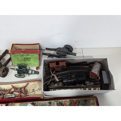 325 - Britains No.1201 Royal Artillery Gun, boxed, and two Britains 18″ Heavy Howitzers with shells, both ... 