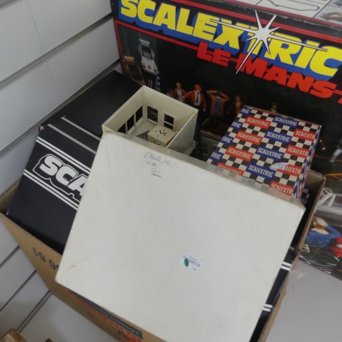 327 - Scalextric; large quantity of including a boxed Le Mans 24 set, various boxed buildings including ow... 