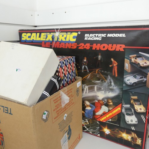 327 - Scalextric; large quantity of including a boxed Le Mans 24 set, various boxed buildings including ow... 