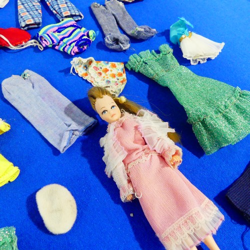 331 - A Pippa Doll, circa 1970s, together with a quantity of original Pippa clothes.