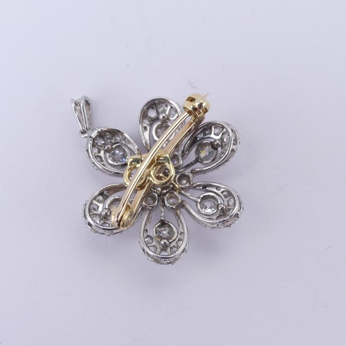  A diamond cluster foliate Pendant / Brooch, the central stone c. 0.25ct, with six smaller stones aro... 