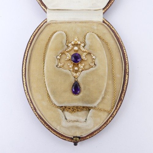  An Edwardian 15ct yellow gold, amethyst and seed pearl Pendant, in the Art Nouveau style, the revers... 