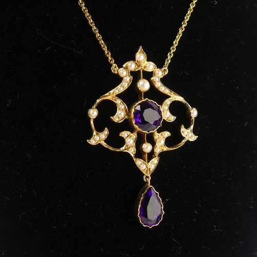  An Edwardian 15ct yellow gold, amethyst and seed pearl Pendant, in the Art Nouveau style, the revers... 