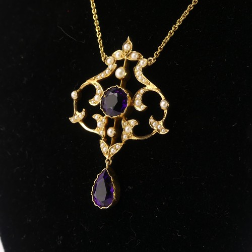  An Edwardian 15ct yellow gold, amethyst and seed pearl Pendant, in the Art Nouveau style, the revers... 