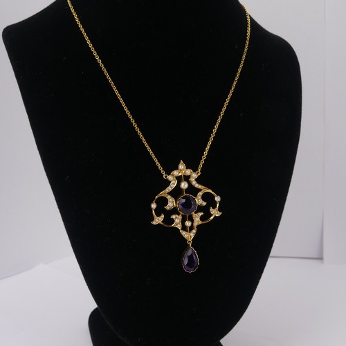  An Edwardian 15ct yellow gold, amethyst and seed pearl Pendant, in the Art Nouveau style, the revers... 