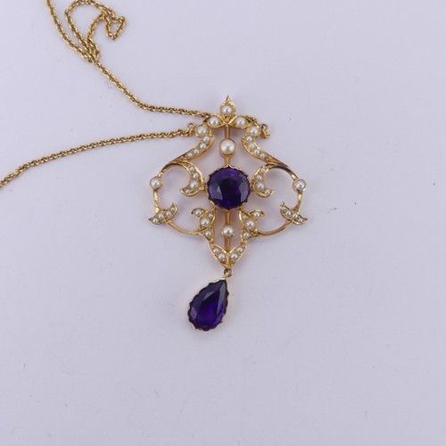  An Edwardian 15ct yellow gold, amethyst and seed pearl Pendant, in the Art Nouveau style, the revers... 