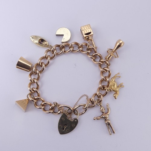  A 9ct yellow gold curb link Bracelet, with 9ct gold padlock clasp, eight charms suspended; one marke... 